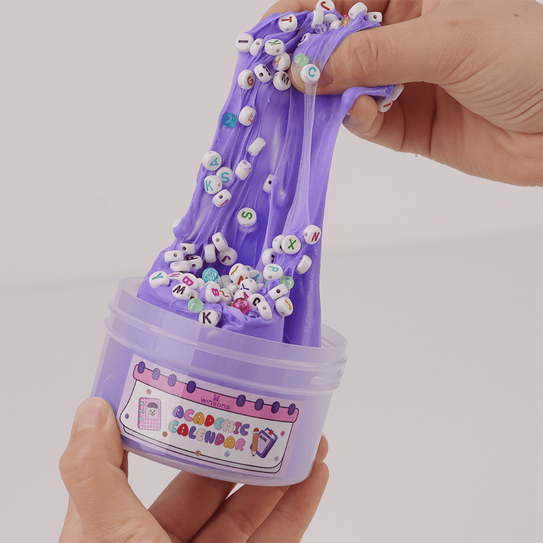 Academic Calendar Slime | Butter Slime | Smooth Slime | DIY Slime Kit | Soft, Stretchy Slime | School-Themed Slime | Book and Pencil Topping Slime | Alphabet Bead Charms | Purple Butter Slime | Stress Relief & Sensory Fun | 8 oz Slime | Non-Sticky, Fluffy Texture | Slime with Toppings | Fun Educational Slime | Relaxing Slime Kit for Kids